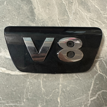Logo krytu motora VW Phaeton 7L6103929